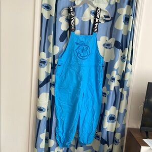 Blue funky smiley face overalls